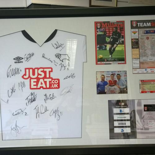 Signed Derby County shirt and related items from a sponsored match.Mount fitted flat to the shirt